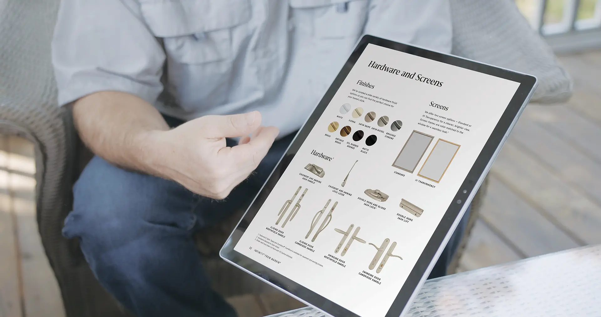 FinishOptions A person wearing a light gray shirt and jeans is seated and holding a large tablet displaying a "Hardware and Screens" catalog with images of finishes, screen options, and hardware types on a wooden deck.